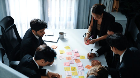 Top view of business people brainstorm idea by using sticky notes while planning marketing strategy...