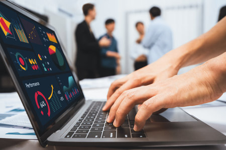 Analyst team uses BI Fintech on a laptop to analyze financial data on blurred background. Business people analyze BI dashboard for insights power into business marketing planning. Prudentの写真素材