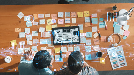 Top view of skilled business woman look at tablet with logo design at meeting. Smart marketing team working on tablet with financial statistic holographic or hologram of stock market chart. Symposium.の写真素材