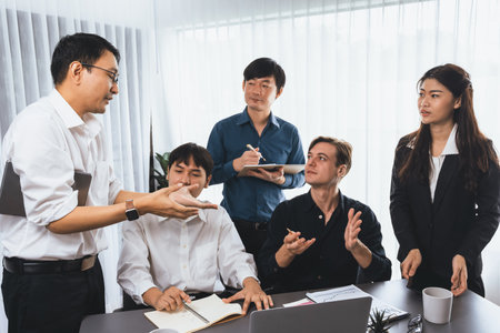 Diverse group of office worker and employee applauding, happily collaborate on strategic business marketing planning. Teamwork and positive attitude create productive and supportive workplace. Prudentの写真素材