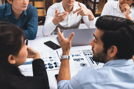Analyst team utilizing BI Fintech to analyze financial data at table in meeting room. Businesspeople...