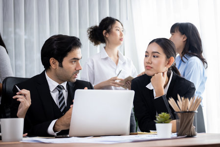 Diverse of business people from various ethnic group working in modern office environment. Productive and multi ethnic office workers engage in discussion for strategic business marketing. Meticulousの写真素材