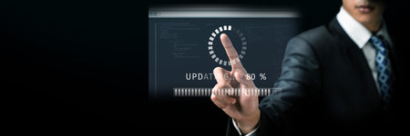 Business person invests in updating knowledge and software, ensuring updated competitiveness. Prioritizing continuous update and upgrading for both knowledge and software efficiency update. FaaSの写真素材