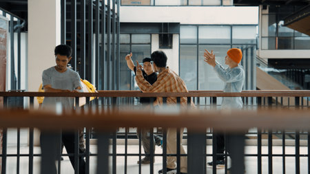 Multicultural hipster group walking while dancing at modern corridor. Attractive break dance team happy and joy while moving to hip-hop music. Active. Site view. Outdoor sport 2024. Hiphop.の写真素材