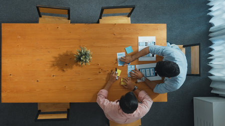 Top down view of business man prepare financial document for meeting while walking at table with...