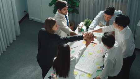 Top view of professional business team working together to brainstorm environmental idea by using...