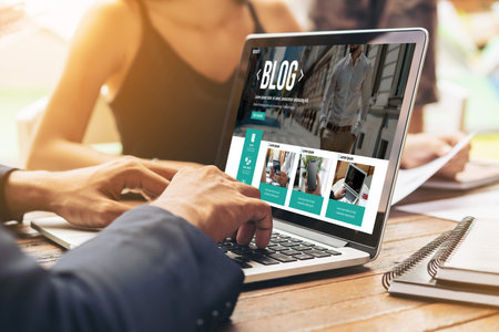 blogging concept, web blog Social Media Information network snugly. social media online content, freelance worker, working online, content creator, blogger, website, reading blog online on computerの写真素材