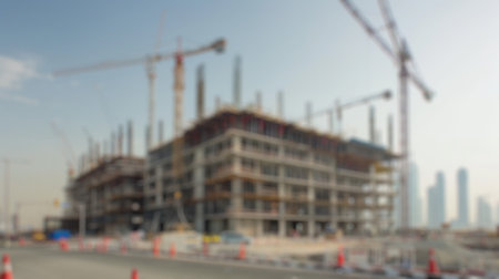 Blur background of new residential house under construction in a suburban area. Real estate development and home building concept. Design for real estate posters, banners. Construction site. Spate.の写真素材