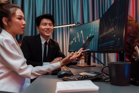 Businessman holding tablet on dynamic stock exchange statistic online showing to partners to share,...