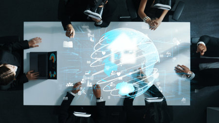 Professional business people wearing VR glass while working by using metadata in virtual world with hologram of big data. Communication technology or software development concept. Directorate.の写真素材