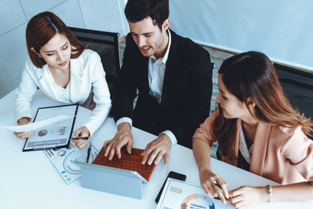 Businessman is in meeting discussion with colleague businesswomen in modern workplace office. People...