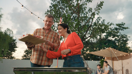 Family all together camp in garden, Old couple grill food for family member. Outdoor camping...