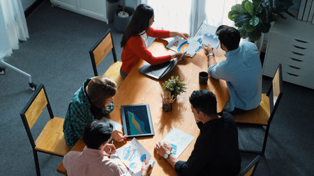Top view of project manager present financial graph to investors at meeting. Professional marketing...