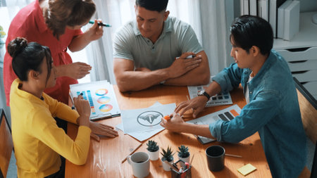 Top aerial view of business people working together to choosing color from color palette. Manager...