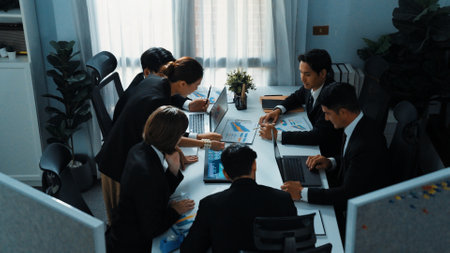 Top view of skilled analytic analysis stock market investment data at meeting. Businessman show increasing graph or financial statistic to investors at table with document and device. Directorate.の写真素材