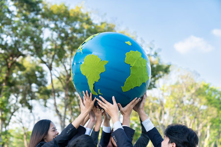Earth day concept with big Earth globe held by group of asian business people team promoting environmental awareness to solve global warming with environmentally sustainability and ESG principle. Gyreの写真素材