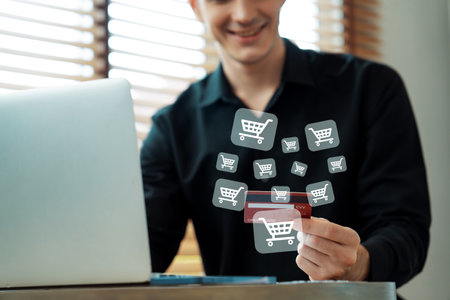 Elegant customer wear white tank top holding credit card control device choosing online platform. Smart consumer opening e-commerce application using cashless technology shopping inventory. Cybercash.の写真素材