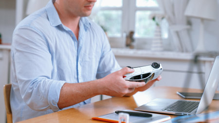 Car design engineer working on car prototype for automobile business at home office. Automotive...