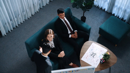 Top view of smart businessman present strategy to group of investor by using mind map brainstorm marketing idea at table with sticky notes and marker at meeting room. Creative workplace. Directorate.の写真素材