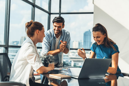 Group of happy businesspeople celebrate their successful project. Professional business team win and proud of their project at modern office. Successful teamwork, happy colleague, workplace. Tracery.の写真素材