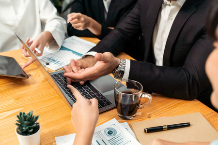 Diverse of business people from various ethnic group working in modern office environment. Productive and multi ethnic office workers engage in discussion for strategic business marketing. Meticulousの写真素材