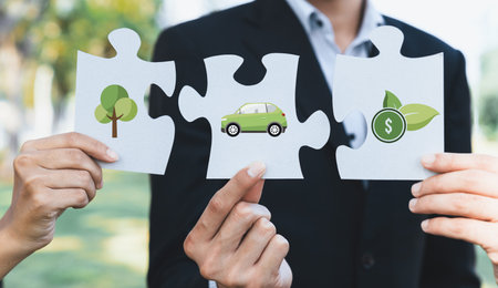 Business people or corporate partnership joining ECO friendly idea puzzle of jigsaw together as group of eco professional teamwork concept to promote social awareness on environmental protection. Gyreの写真素材