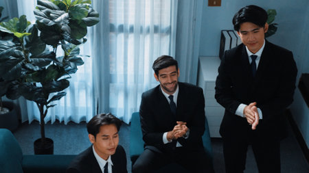 Top view of professional businessman present startup project and shake hand with diverse investor while clapping hands to celebrate and congratulate successful agreement at meeting room. Directorate.の写真素材