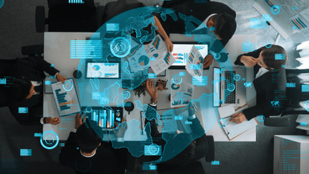 Top down aerial view of skilled business team listening manager present global networking system while giving a high five to encourage or motivate team. Hologram of internet connection. Directorate.の写真素材