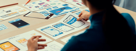 Panorama banner of startup company employee planning on user interface prototype for mobile...