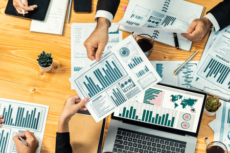 Top view diverse group of business analyst team analyzing financial data report paper on meeting...