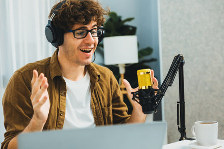 Host channel of influencer using headphone and mic talking with listeners on social media with...