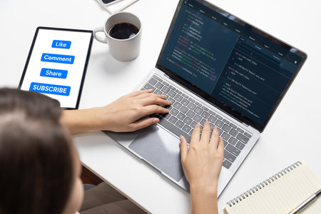Hand focus of IT developer woman coding on laptop screen, creating social media website system of like, comment, share and subscribe automatic thinking program update data center at office. Postulate.の写真素材
