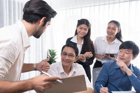 Group of diverse office worker employee working together on strategic business marketing planning in corporate office room. Positive teamwork in business workplace concept. Prudentの写真素材