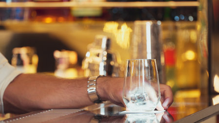 Closeup bartender hand serving in fresh soda gas texture into glass of drink advertisement serving customer at beverage bar counter luxury pub for welcome impression greeting guess service. Vinosity.の写真素材
