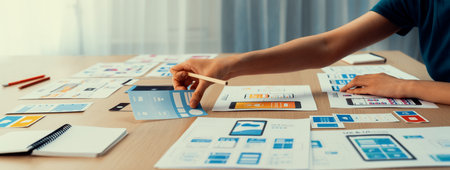 Panorama banner of startup company employee planning on user interface prototype for mobile...