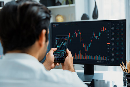 Trader businessman searching on smartphone, analyzing in dynamic stock exchange investment screen on...
