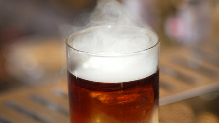 Focusing serving mist smoky classical in Old fashioned of whiskey cocktail presentation on bokeh...