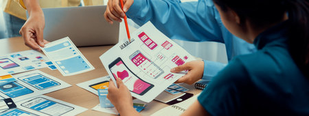 Panorama banner of startup company employee planning on user interface prototype for mobile...