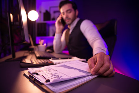 Smart businessman calling partner or investor on smartphone, discussing on target market database...