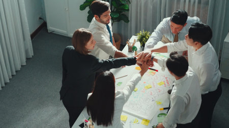 Top view of professional business team working together to brainstorm environmental idea by using...