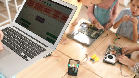Top view of smart caucasian teacher coding engineering prompt and generated AI while diverse...