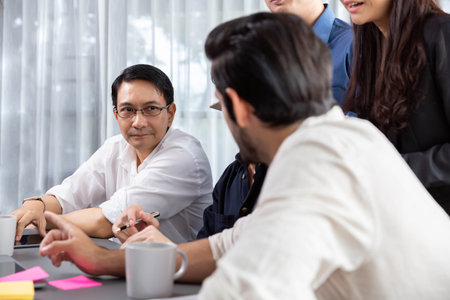 Group of diverse office worker employee working together on strategic business marketing planning in corporate office room. Positive teamwork in business workplace concept. Prudentの写真素材