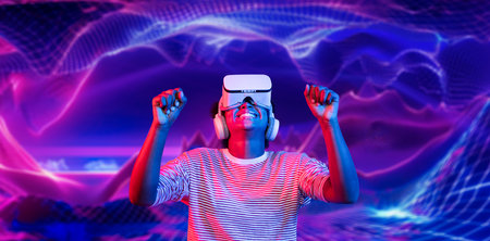 African girl with VR glasses plays video game while enters metaverse by using augmented reality...