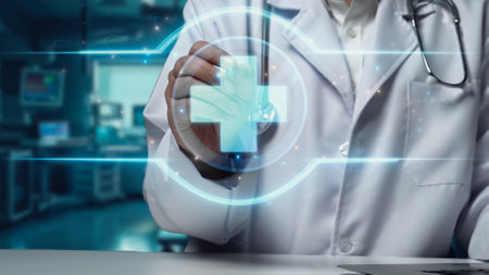 Close up of doctor sitting at table with tablet while pointing at medical cross hologram floating at laboratory. General practitioner inspecting medical data while preparing for treatment. Remedial.の写真素材