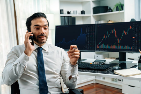 Trader businessman calling to consultant or partner with two stock exchange investment, compare data analysis to invest high profit value dynamic financial technology stock market at office. Surmise.の写真素材