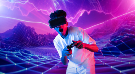 Teenager holding joystick and wearing VR goggles while enjoy playing games at neon abstract...