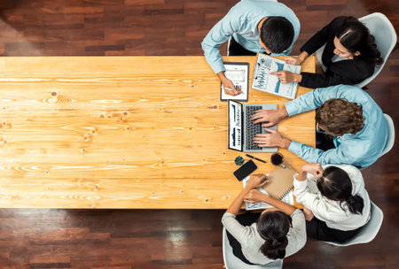 Panorama top view diverse group of business analyst team analyzing financial data report paper on meeting table. Chart and graph dashboard by business intelligence analysis. Meticulousの写真素材
