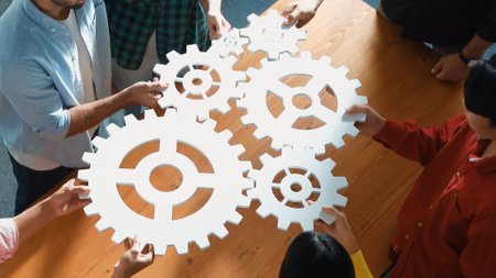 Top view of smart creative people gather white cog together at meeting. Group of project manager helping and team working to solve problem at meeting room or workplace. Represent unity. Convocation.の写真素材