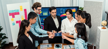 Multiethnic business people holding jigsaw pieces and merge them together as effective solution solving teamwork, shared vision and common goal combining diverse talent. Meticulousの写真素材
