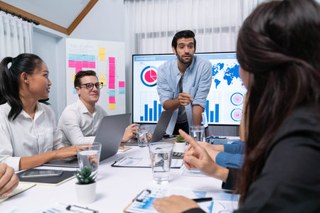 Analyst team utilizing BI Fintech to analyze financial data at table in meeting room. Businesspeople analyzing BI dashboard power for business insight and strategic marketing planning. Prudentの写真素材
